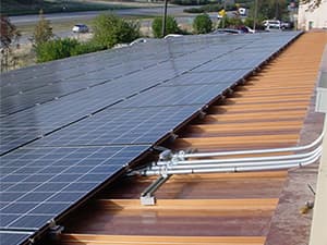 Solar panels installed on large commercial building roof for energy savings