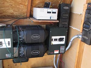 Off-Grid Solar Panel System Large solar panel system installed on rural hillside for off grid power