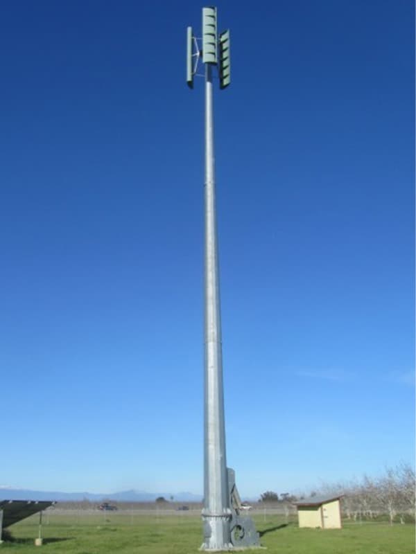 Wind Turbine on Farm as Part of Renewable Energy Power System Wind turbine on farm as part of renewable energy power system