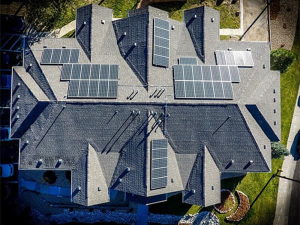 Residential Solar Panels Installation Aerial view of residential solar panels installed on home roof in Northern California