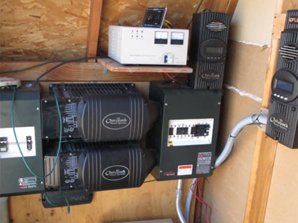 Off-Grid Solar Panel System Large solar panel system installed on rural hillside for off grid power